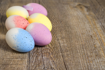Obraz na płótnie Canvas Easter eggs on wooden floor