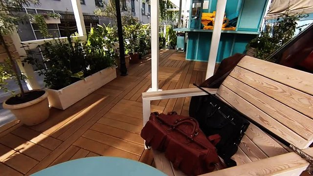 Outdoor caffee interior with chess board, violin, man bags