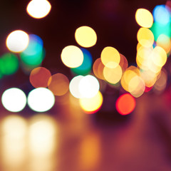 Obraz premium Blurred background with lights of the city at night. Bokeh basic background for design