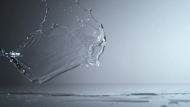 Camera follows water splash on surface. Shot with high speed camera, phantom flex 4K. Slow Motion.