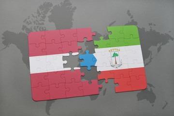 puzzle with the national flag of latvia and equatorial guinea on a world map