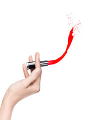 Arm holding red lipstick with splash creative