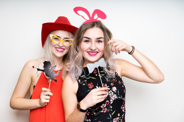 happy ladies girls female with fancy dress photo booth props smile party white isolated background