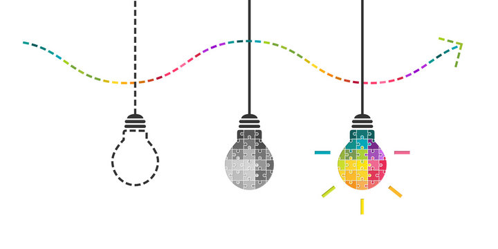 Thinking, perseverance and success concept with light bulb made of colorful puzzle pieces