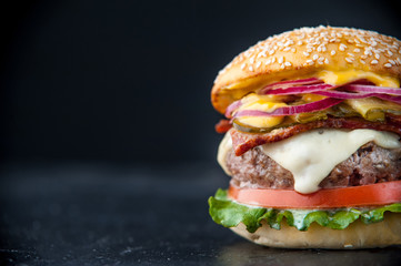 Delicious fresh homemade burger on a wooden table
