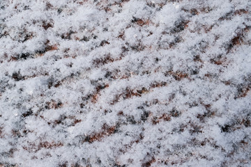Abstract background of the surface of the granite in the snow
