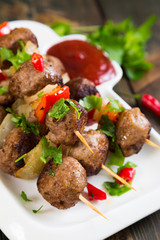 Kebab with meat balls and vegetables