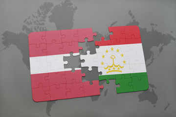 puzzle with the national flag of latvia and tajikistan on a world map