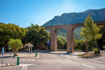Fototapeta na wymiar Aqueduct over the road in the mountains of Mallorca, Spain