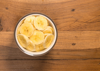 From above view of glass bowl of banana slices