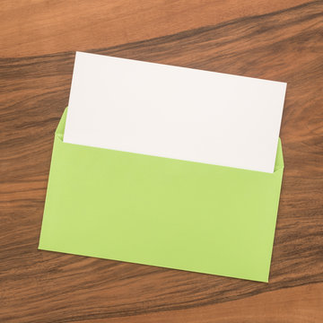Green envelope with blank paper 