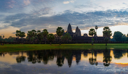 Fototapeta na wymiar Sunrise at Angkor Wat Temple. Twillings time.
