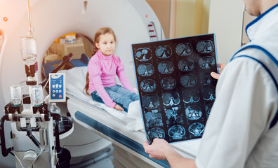 Medical equipment. Doctor and patient in the room of computed tomography