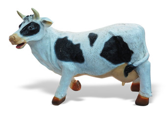 White and black cow toy figurine isolated