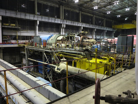 Steam turbine during repair, machinery, pipes, tubes at a power plant