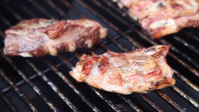 BBQ Video close up with meat on hot gas grill