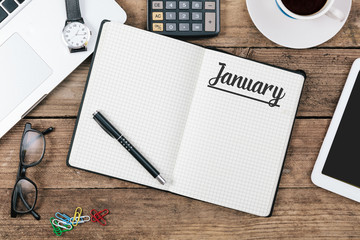January on note book at office desktop