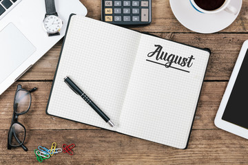 August month on note book at office desktop