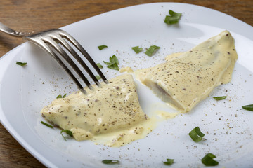 Marinated mackerel fillet with mayonnaise and herbs on plate