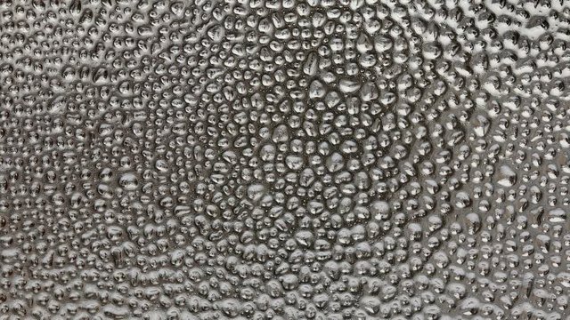 Water drops at glass, or transparent surface zoom out HD footage