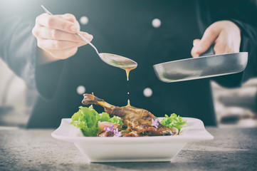 The chef prepares a gourmet meal.