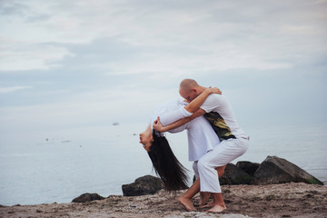couple dancing on the beach.