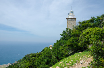 Fototapeta na wymiar Mui Dinh lighthouse with beautiful view to sea, it is located on a hill of Ca Na, Ninh Thuan, Vietnam.
