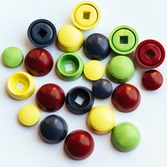 Colored plastic caps isolated on white background