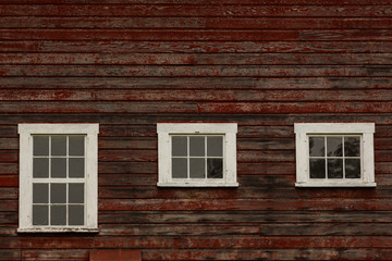 Old Barn windows with weathered red pain