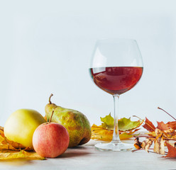 Autumn still life. Golden leaves a apples and pears