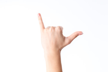 female hand showing the gesture with extended up the little finger and thumb is isolated on a white background