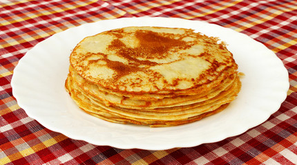 Pancakes on a white plate