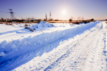 Fototapeta na wymiar Beautiful Russian winter road at sunset