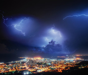 Night lights of the coastal city from the height