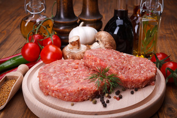 Uncooked hamburger meat with spices
