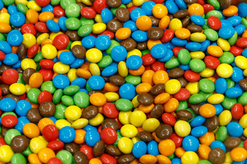 Fototapeta na wymiar Colorful sugar covered chocolate candy