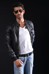 Fototapeta premium handsome man wear black leather jacket with blue jean