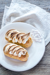 Eclairs with lemon curd and meringue