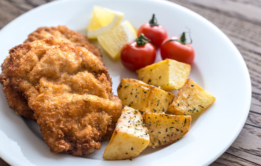 Portion of schnitzel with garnish
