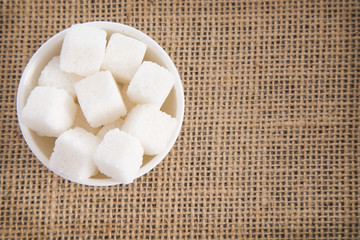 Cubes of sugar in the bowl
