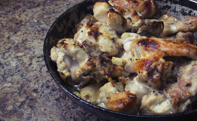 chicken in mustard sauce. chicken pieces in the pan. cooking. The finished dish