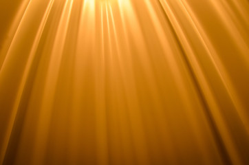 Naklejka premium Smooth creases and folds on a orange fabric with upper lighting and deep shadows 