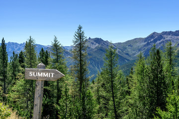 Mountains with sign summit.