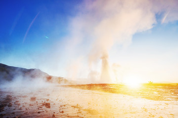 Fantastic sunset Strokkur geyser eruption in Icelan