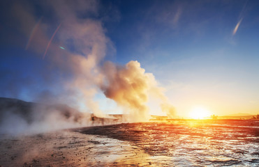 Fototapeta premium Fantastic sunset Strokkur geyser eruption in Iceland