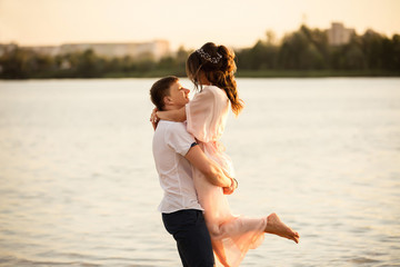 Couple embracing near sea or ocean at honeymoon