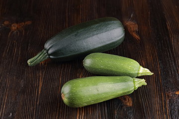 Courgettes on a wooden background.