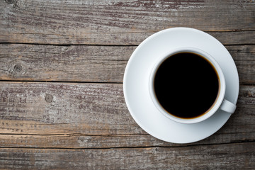 Coffee cup on an old wooden table