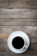 Coffee cup on an old wooden table