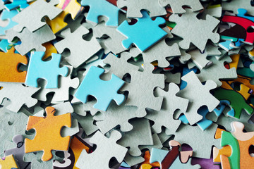 Puzzle pieces closeup. Textured background of puzzles
